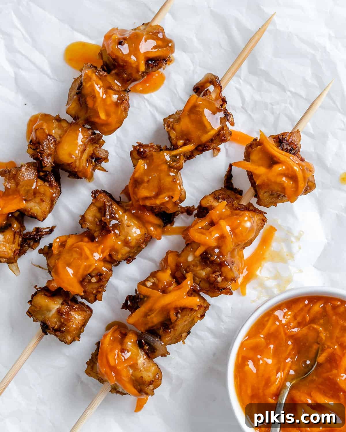 Another perspective of the completed Vegan Kabobs with Marinated Tempeh, showing their appetizing glaze and ready-to-eat appeal on a white background.