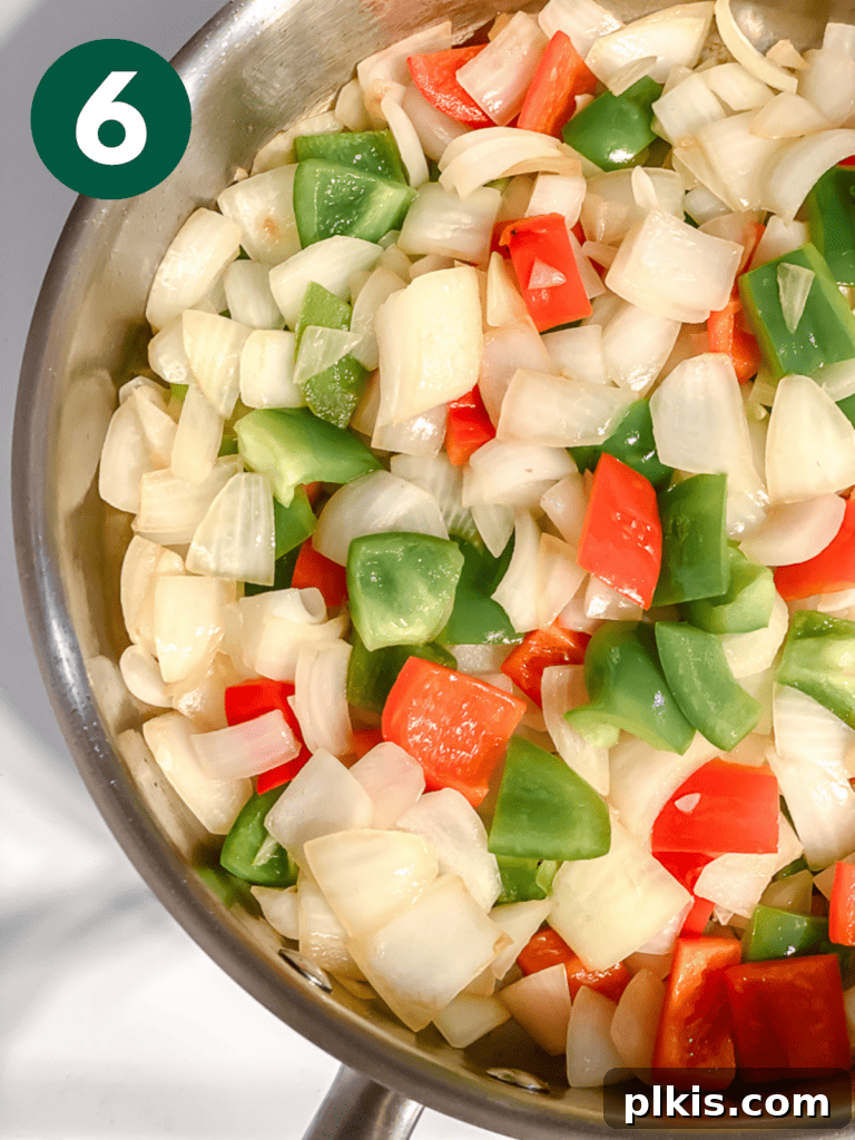 Golden Sweet and Sour Tofu 9 Process shot showing vegetables actively cooking in the pan, softening slightly.