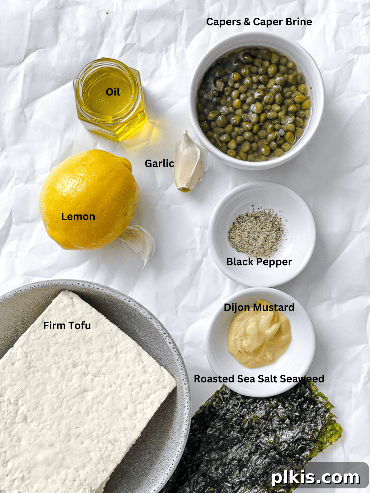 Creamy Vegan Caesar 3 ingredients for Vegan Caesar Dressing laid out on a white surface