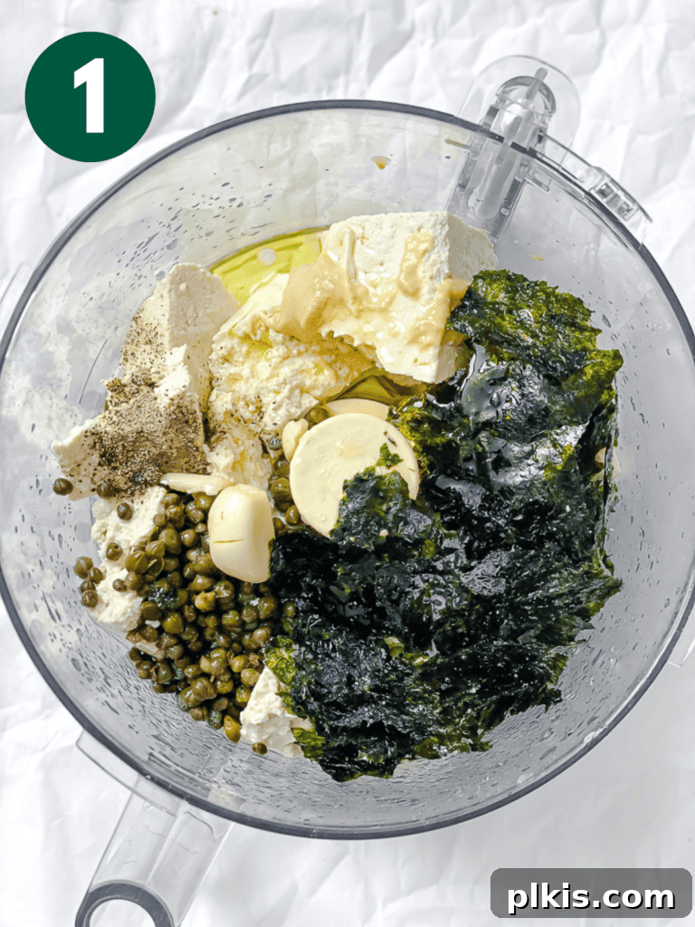Creamy Vegan Caesar 4 process shot of adding ingredients to a food processor for vegan Caesar dressing