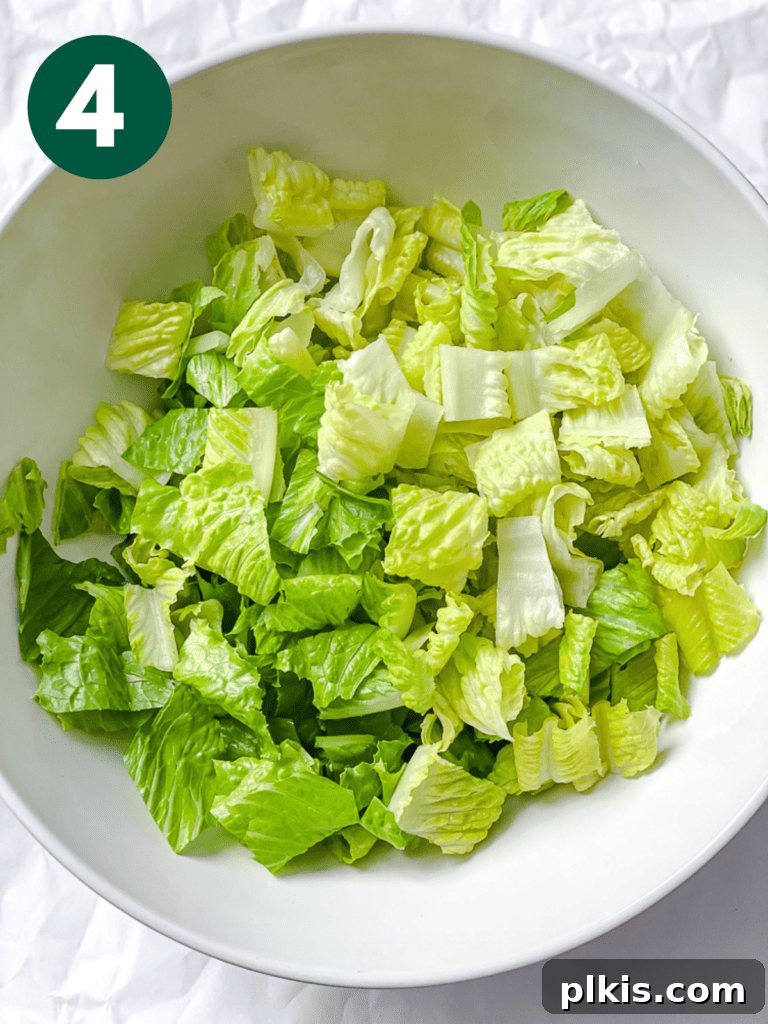 Ultimate Vegan Caesar 7 process shot showing post sliced lettuce in bowl