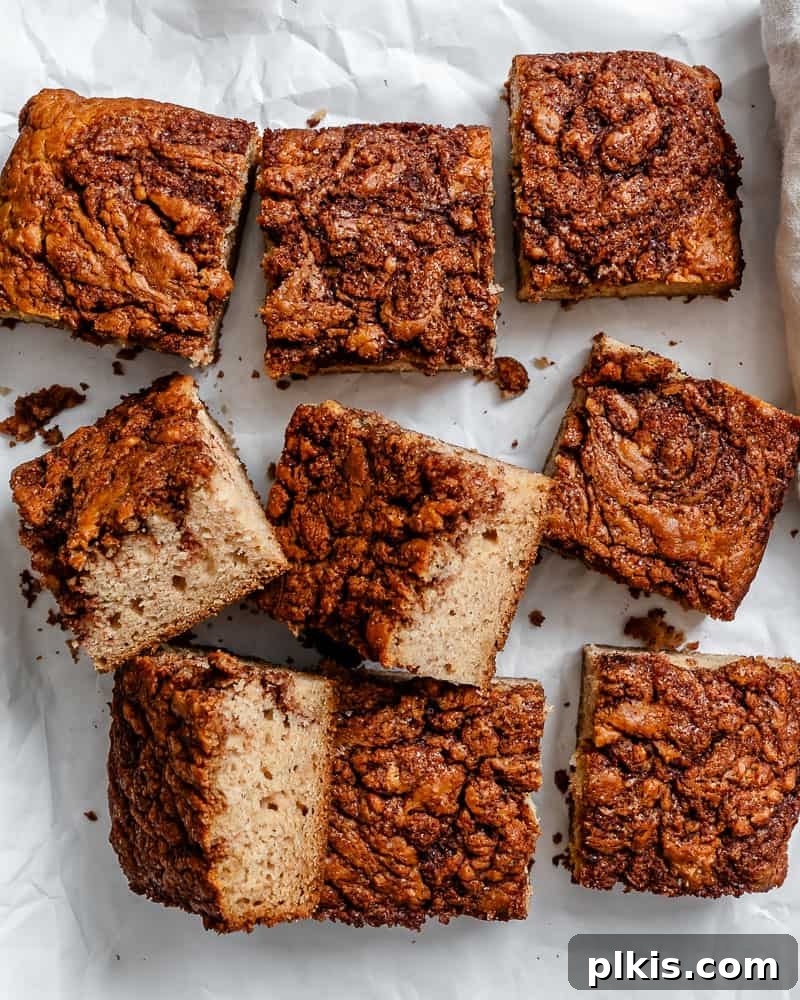Irresistible Vegan Coffee Cake 2 Delicious squares of freshly baked Vegan Coffee Cake on a white surface, ready to be enjoyed.