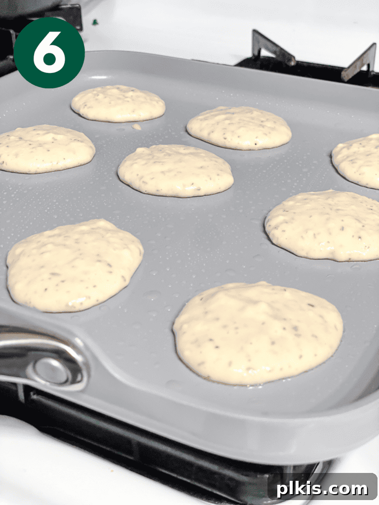 Simple Vegan Pancakes: Classic or Bite-Sized 9 process shot showing mini pancakes cooking on a pan
