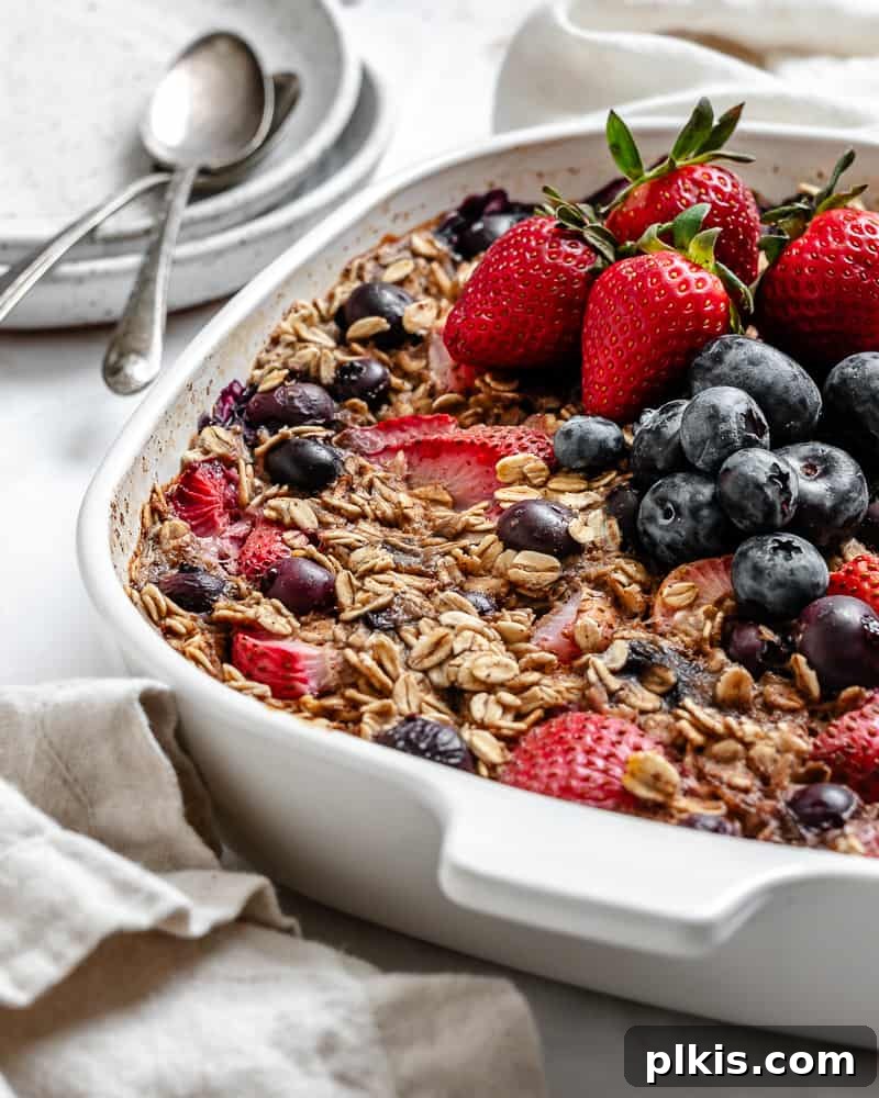 Vegan Berry Baked Oatmeal 2 Completed Vegan Baked Oatmeal with Mixed Berries in a baking dish, ready to serve.