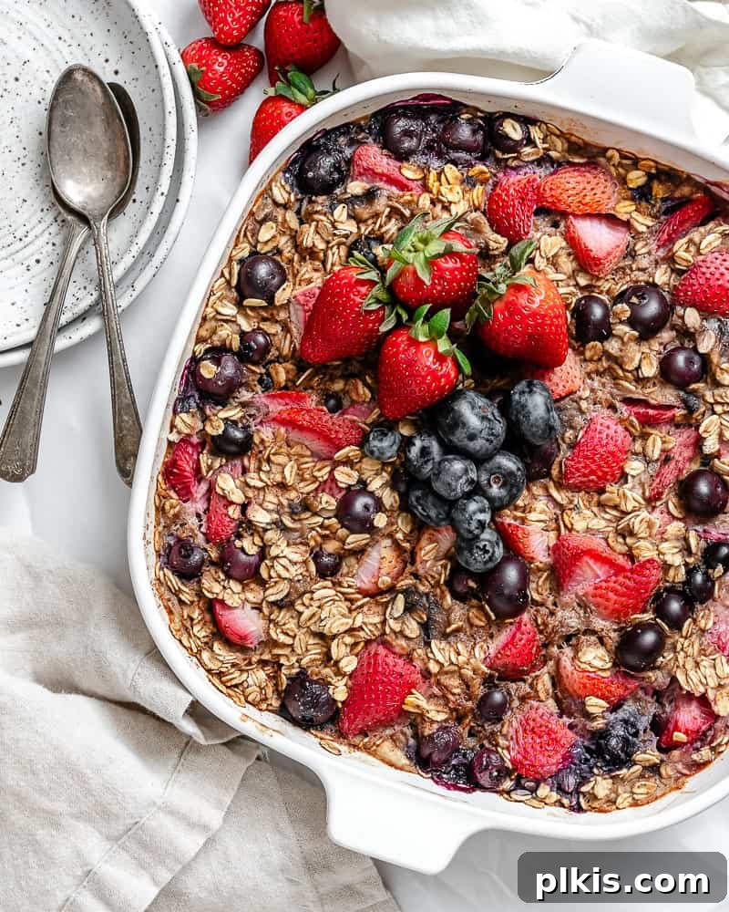 Vegan Berry Baked Oatmeal 7 Completed Vegan Baked Oatmeal with Mixed Berries in a baking dish, garnished and ready.