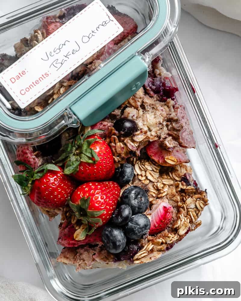 Vegan Berry Baked Oatmeal 8 Completed Vegan Baked Oatmeal with Mixed Berries in a storage container.