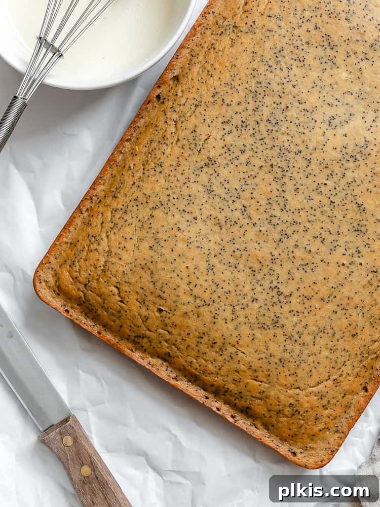 Zesty Lemon Poppy Seed Cake 7 Process shot showing a beautifully baked lemon poppy seed cake, just out of the oven.