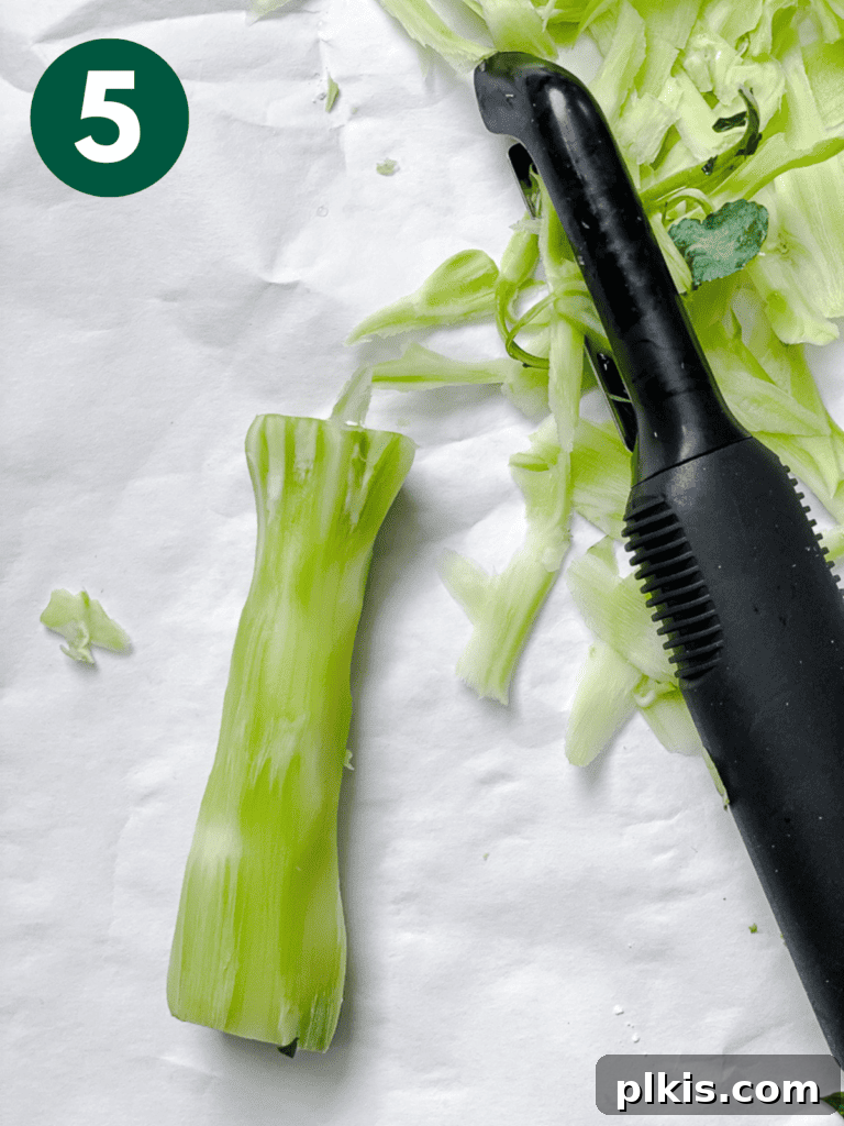 Detailed process shot showing how to cut broccoli florets for stir-frying.