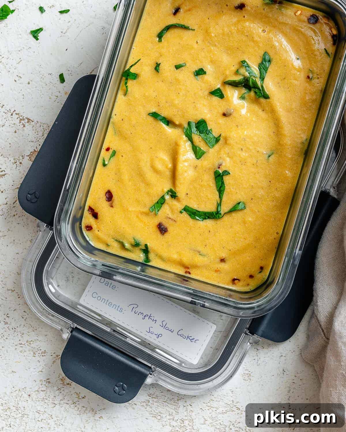 Cozy Slow Cooker Spiced Pumpkin Bisque 14 completed Slow Cooker Pumpkin Soup in a storage container