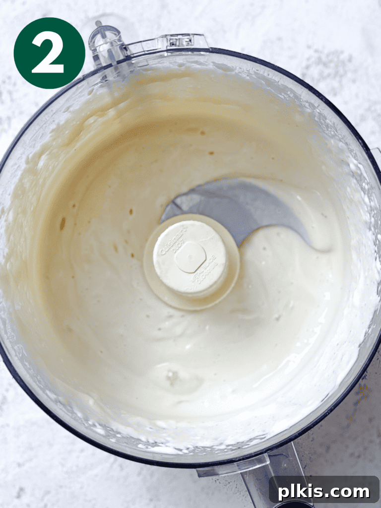 Creamy Oil-Free Vegan Mayo 5 process shot showing post processed vegan mayo ingredients in food processor