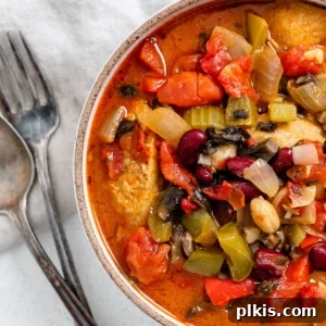 completed vegan gumbo in a white bowl alongside utensils