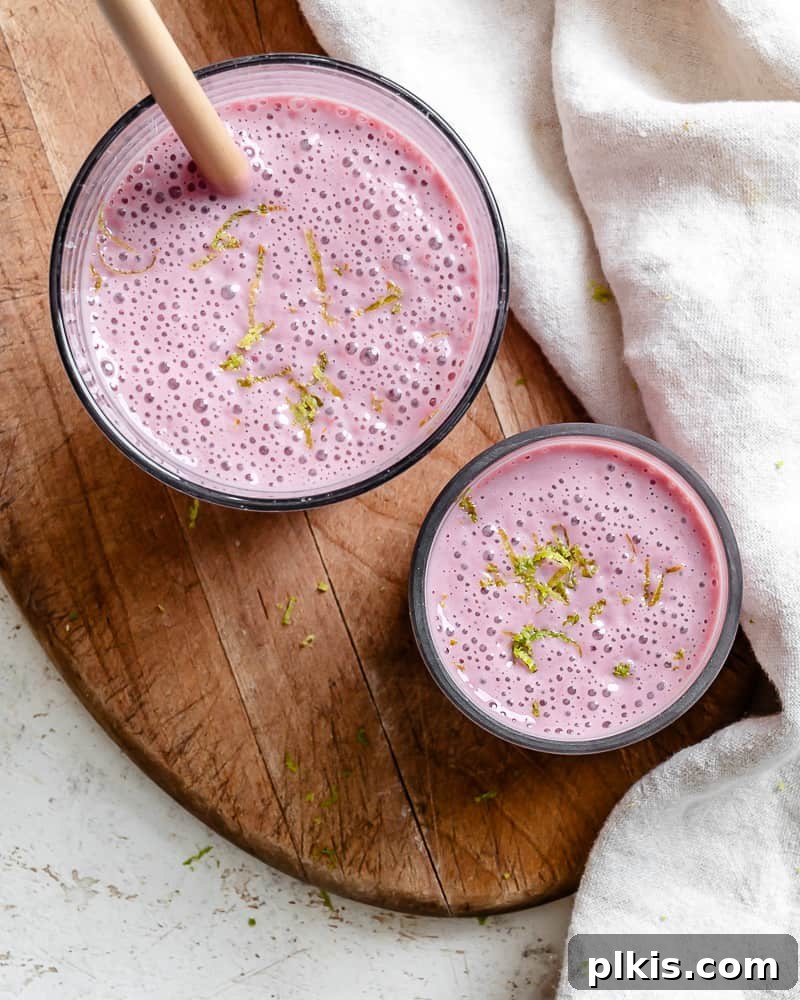 Effortless Raspberry Refresh 6 A beautifully presented, creamy banana raspberry smoothie in glasses, ready to be enjoyed.