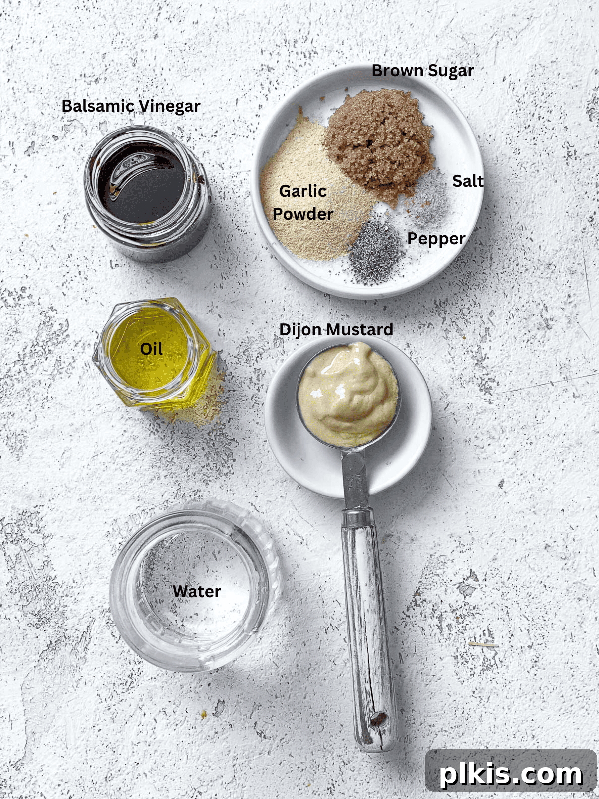 Easy Balsamic Vinaigrette 3 ingredients for Basic Balsamic Vinaigrette measured on a white surface