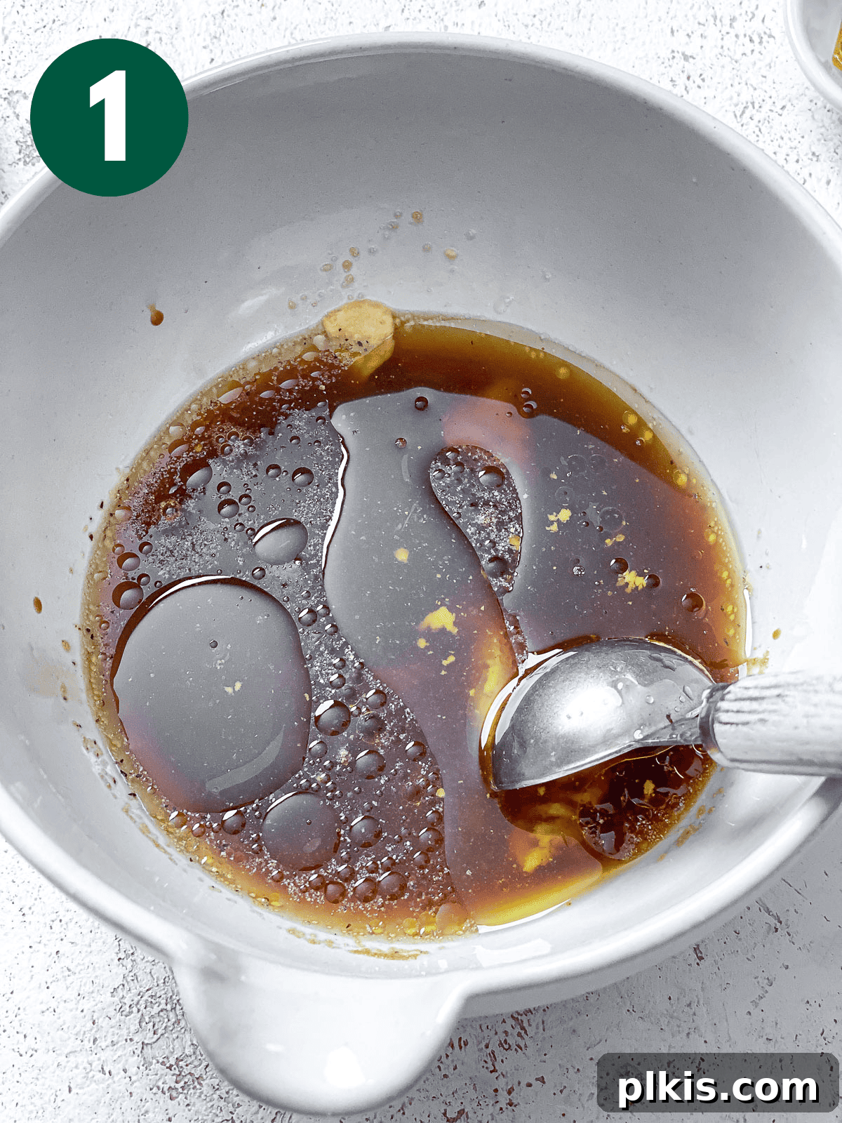 Easy Balsamic Vinaigrette 4 process shot of stirring ingredients in bowl