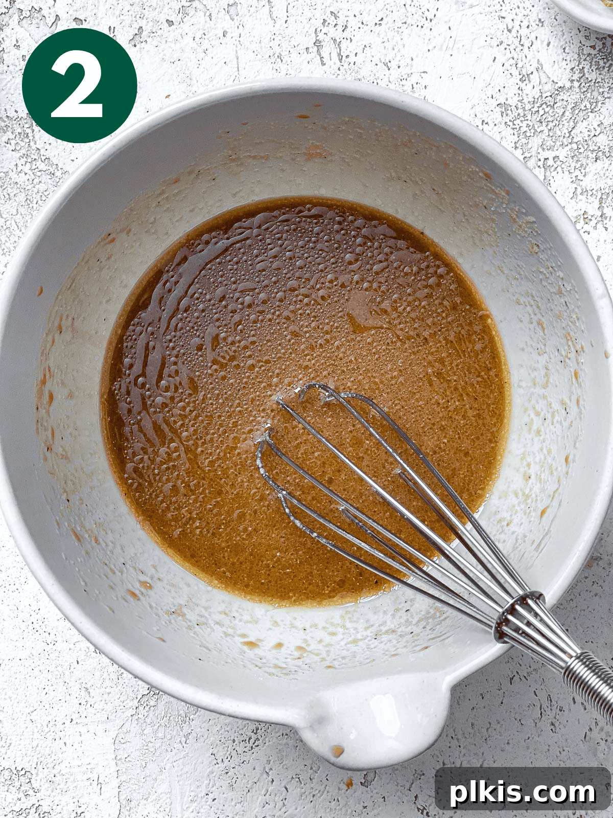 Easy Balsamic Vinaigrette 5 process shot of stirring ingredients in bowl