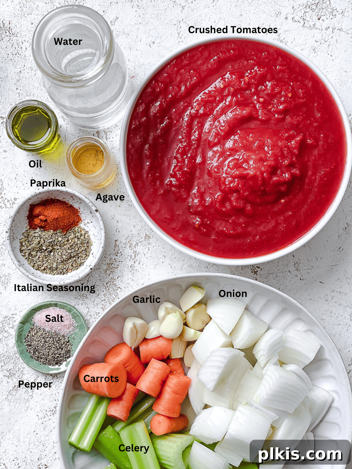 Vibrant Vegan Marinara 3 ingredients for Vegan Spaghetti Sauce measured out on a white surface