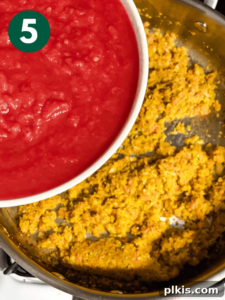 Vibrant Vegan Marinara 8 process shot showing tomatoes being added to pot