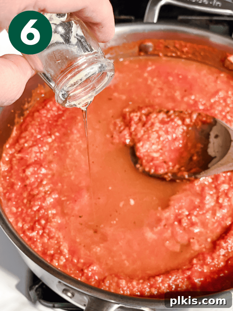 Vibrant Vegan Marinara 9 process shot showing water being added to pot