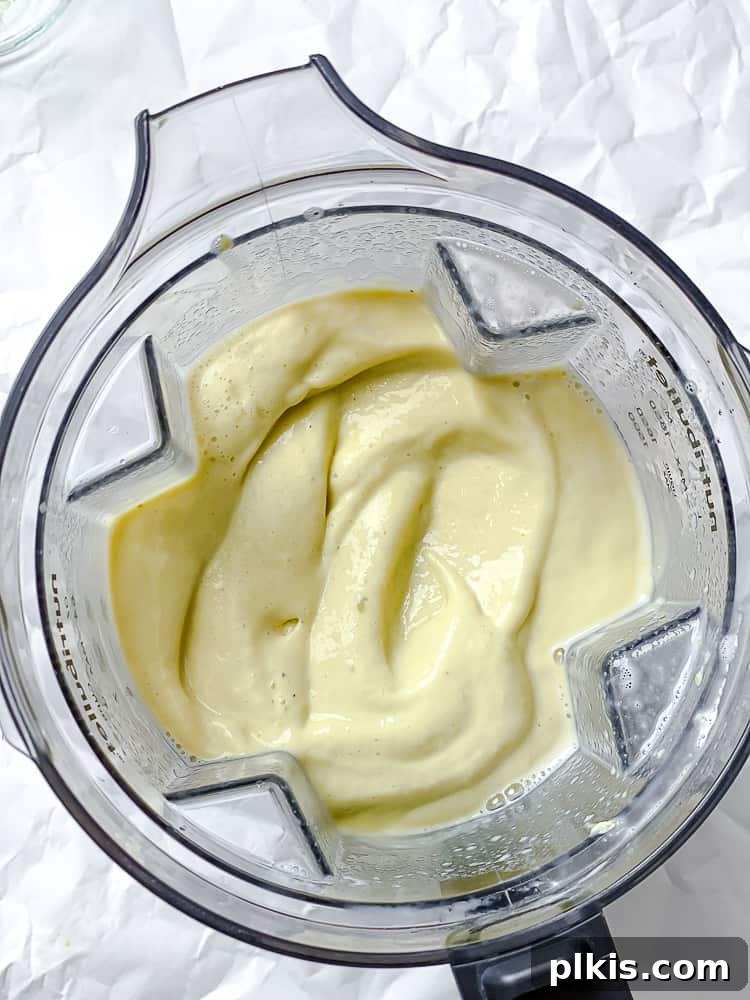 Tropical Mango Avocado Dream 5 Second step: Blending all ingredients in a blender to achieve a smooth consistency.