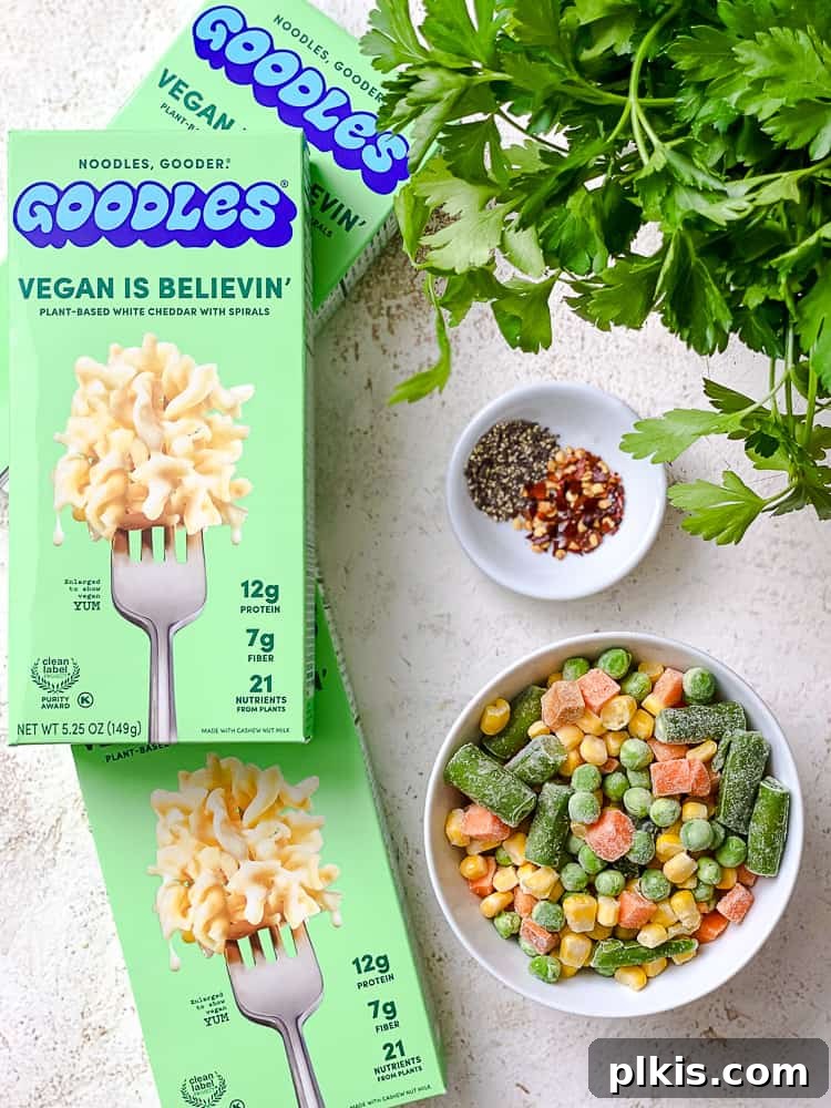 Elevate Your Boxed Mac and Cheese 3 ingredients for Goodles Vegan Mac and Cheese on a white surface