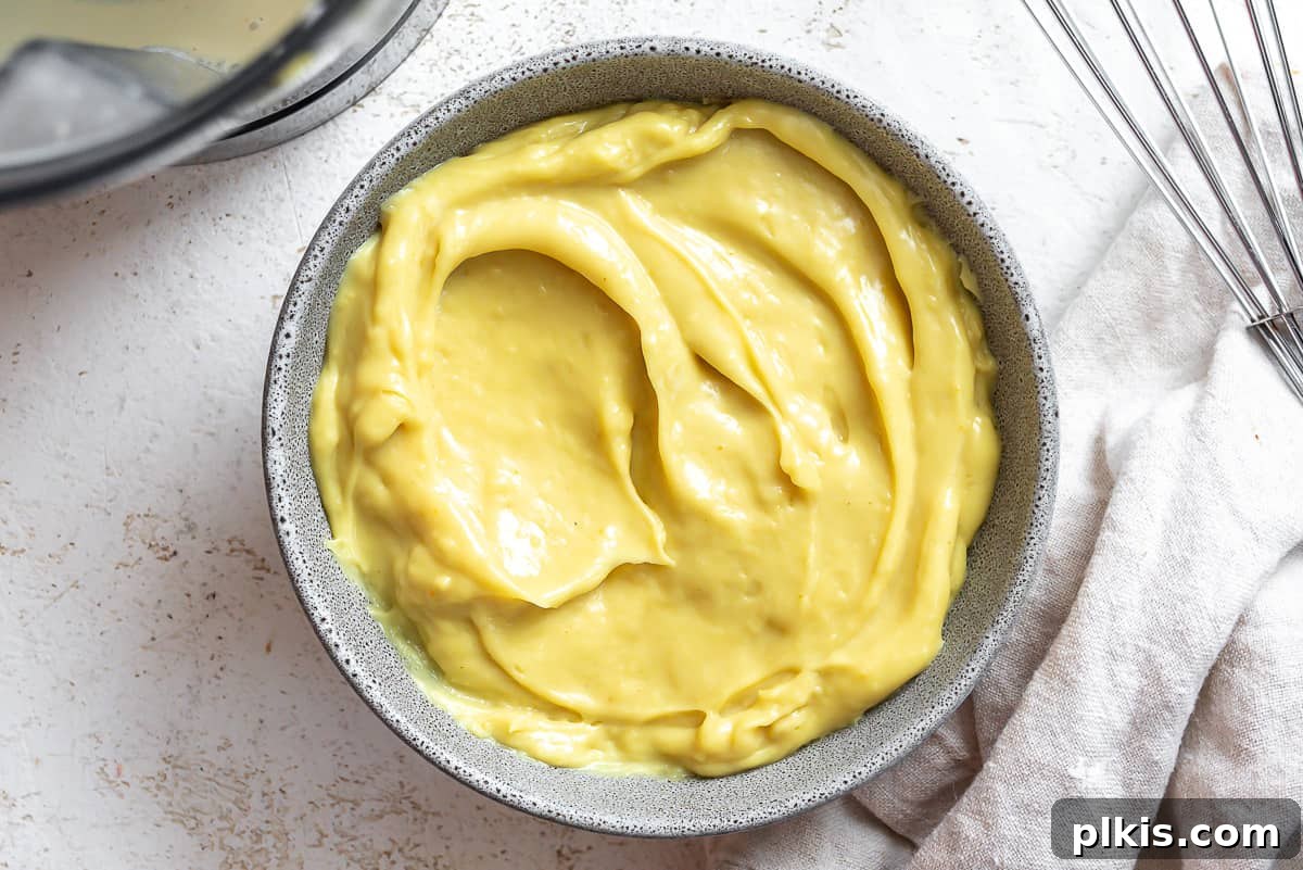 Decadent Vegan Custard 11 A bowl of rich, yellow vegan custard, beautifully plated for enjoyment.