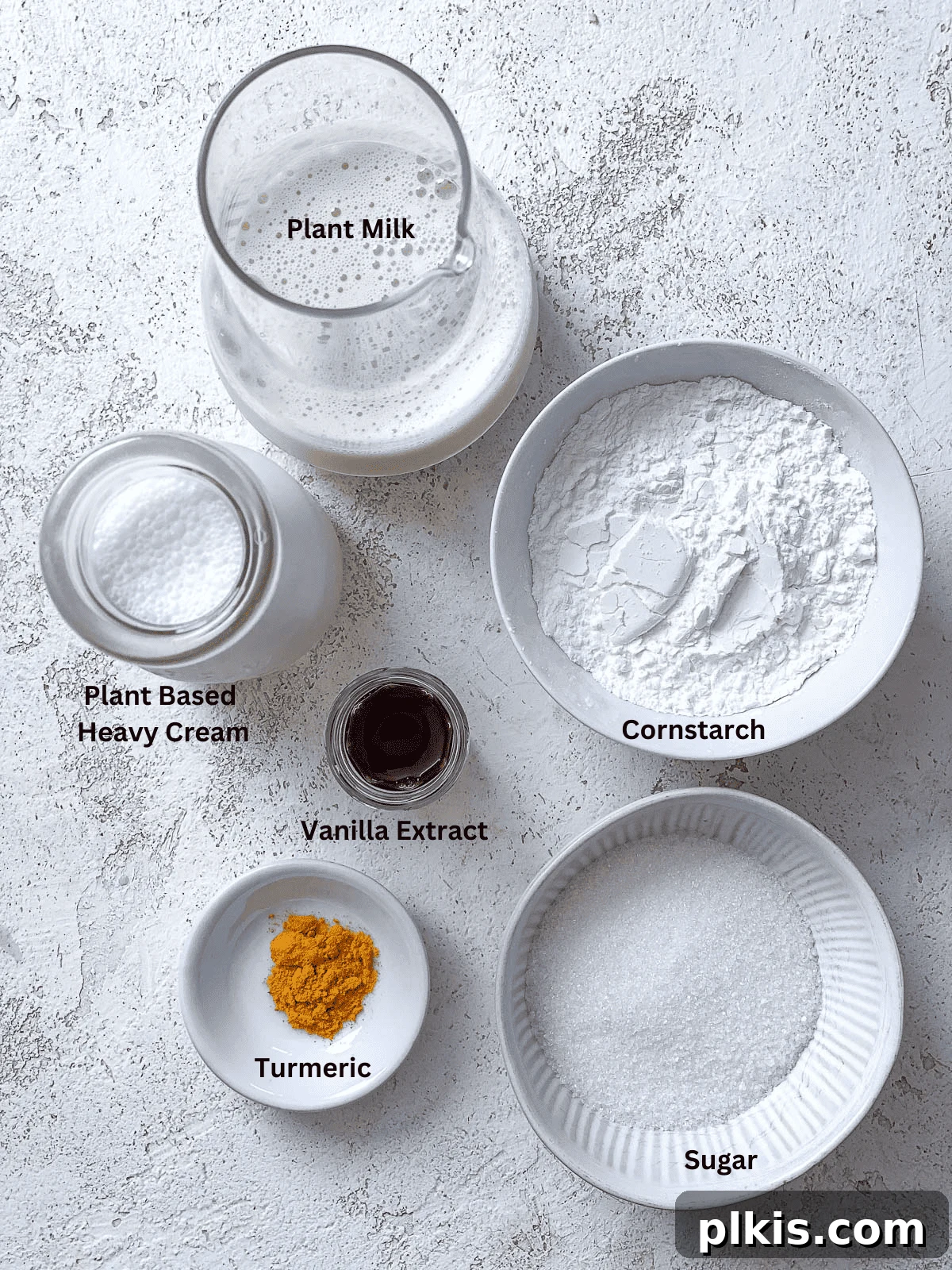 Decadent Vegan Custard 3 Labeled ingredients for making vegan custard, showcasing each item clearly.
