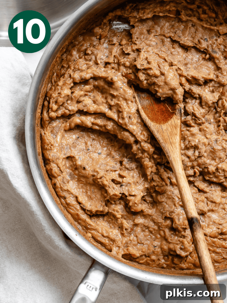 Creamy Plant-Powered Refried Beans 13 A pot of creamy, perfectly mashed Vegan Refried Beans ready to be served