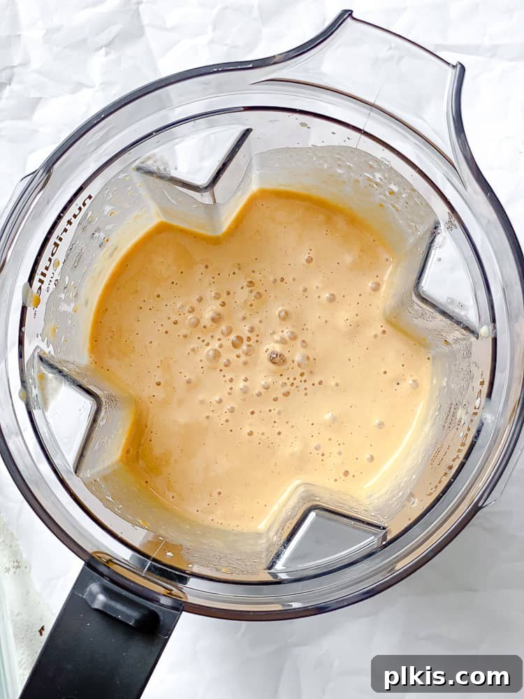 Golden Harvest Smoothie 5 process shot showing Sweet Potato Smoothie in blender after blending