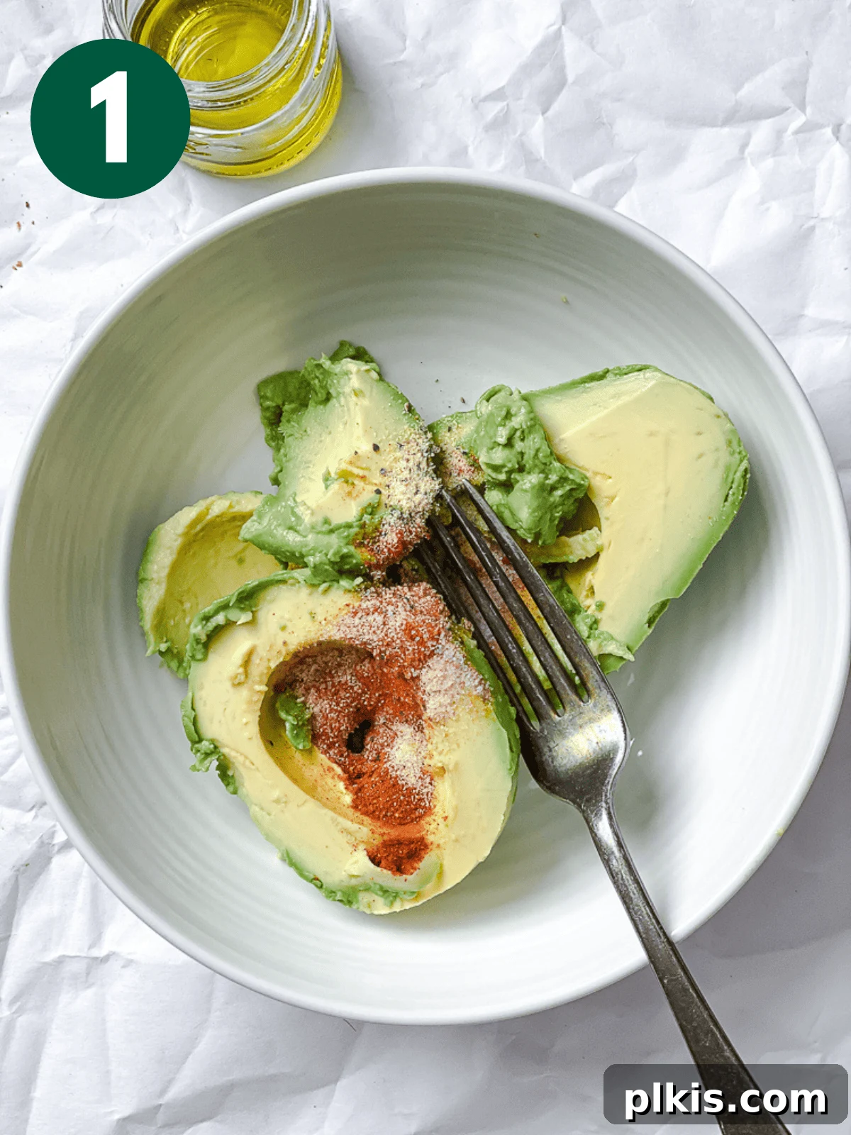 process shot of mashing avocado in a bowl