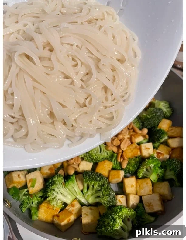 Traditional Tofu Pad Thai 14 process of adding noodles to pan