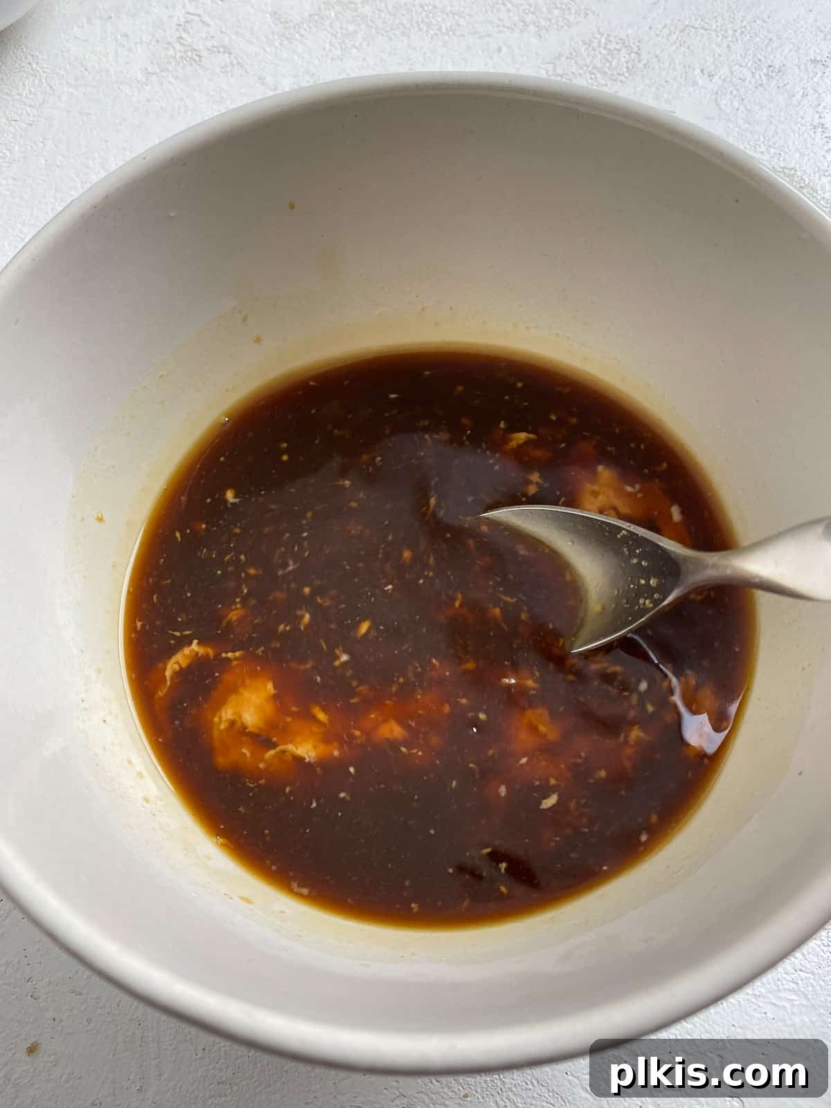 Traditional Tofu Pad Thai 4 process shot of mixing sauce ingredients together in a bowl