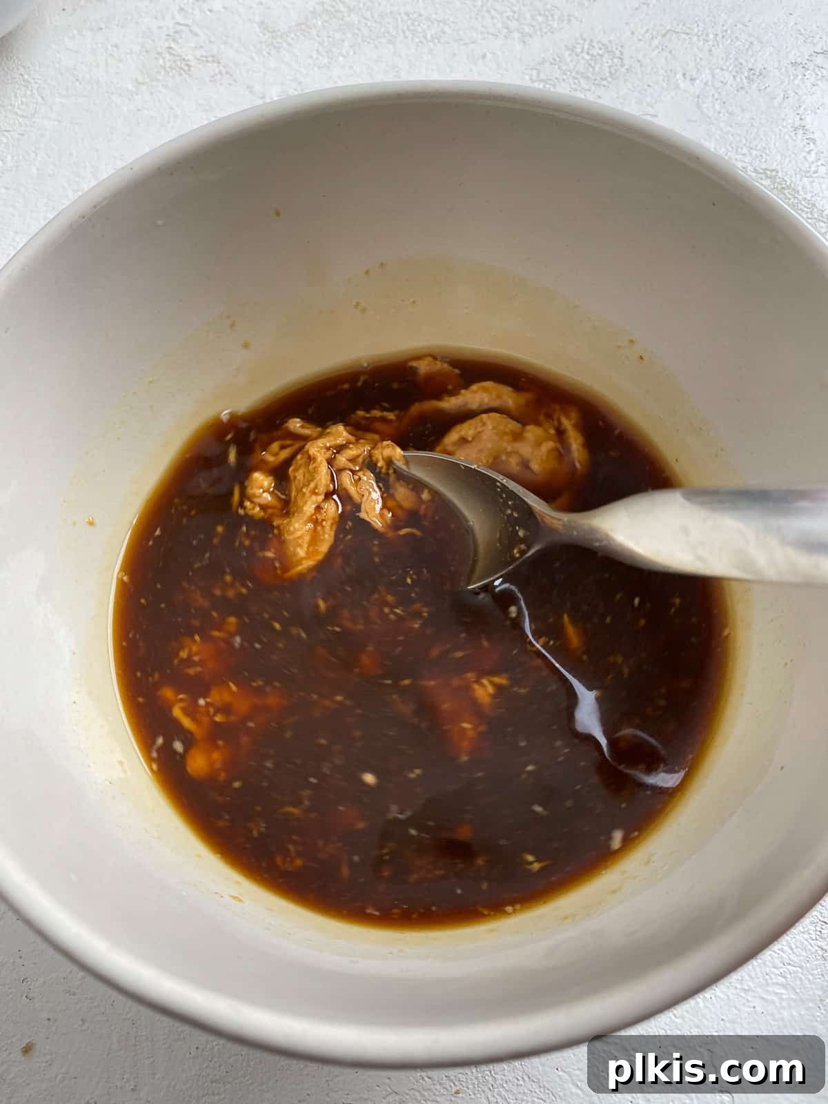 Traditional Tofu Pad Thai 5 process shot of mixing sauce ingredients together in a bowl