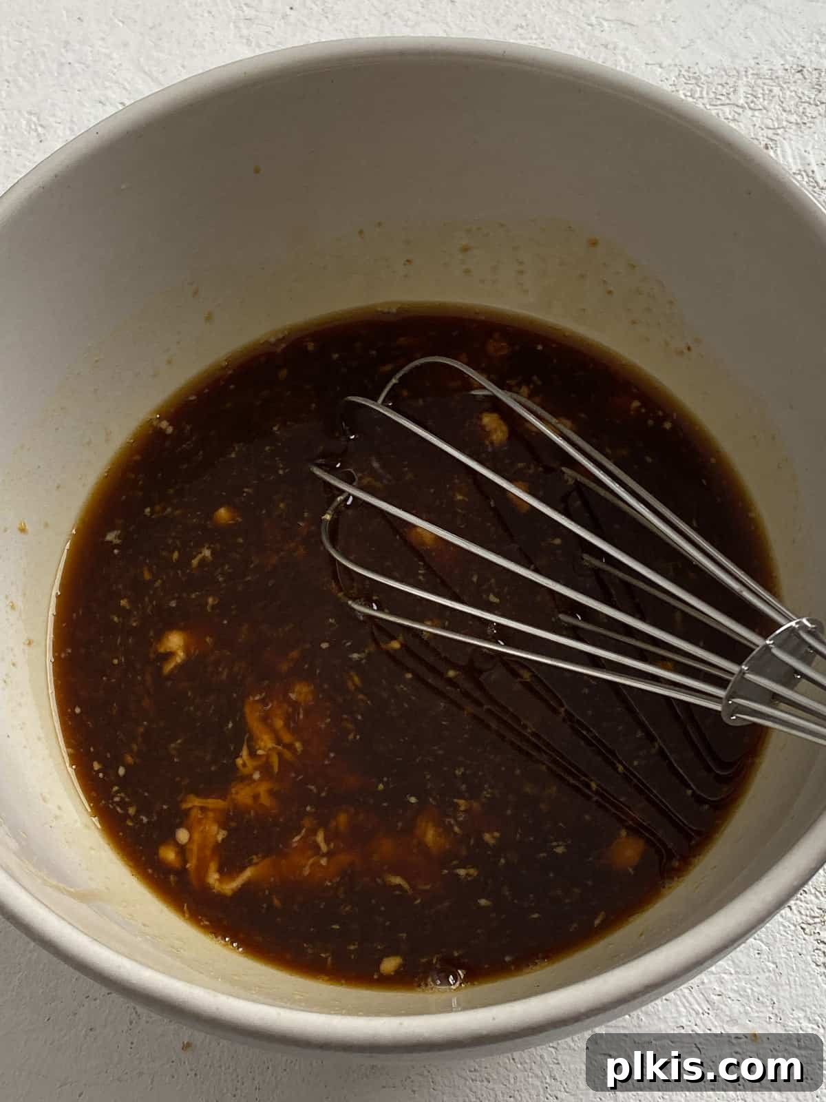 Traditional Tofu Pad Thai 7 process shot of mixing sauce ingredients together in a bowl