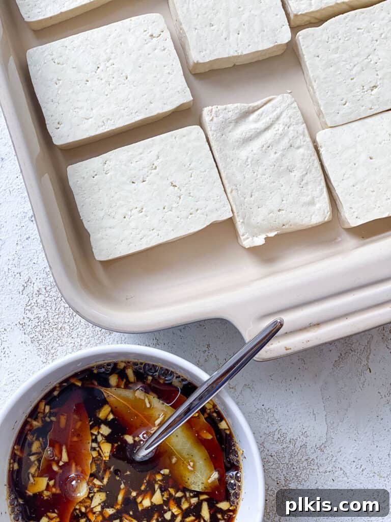 Effortless Tofu Adobo 8 Process shot showing sliced tofu alongside the prepared marinade.