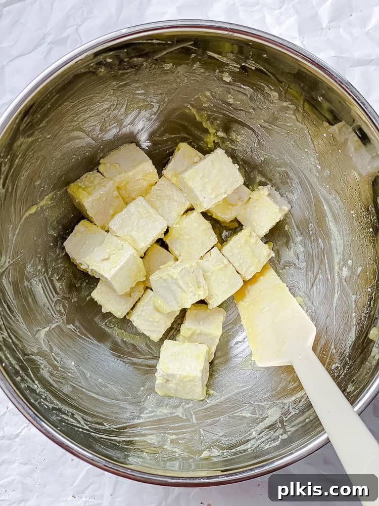 Golden Crisped Tofu Bites 4 process shot showing tofu being mixed with cornstarch in bowl for Salt and Pepper Tofu
