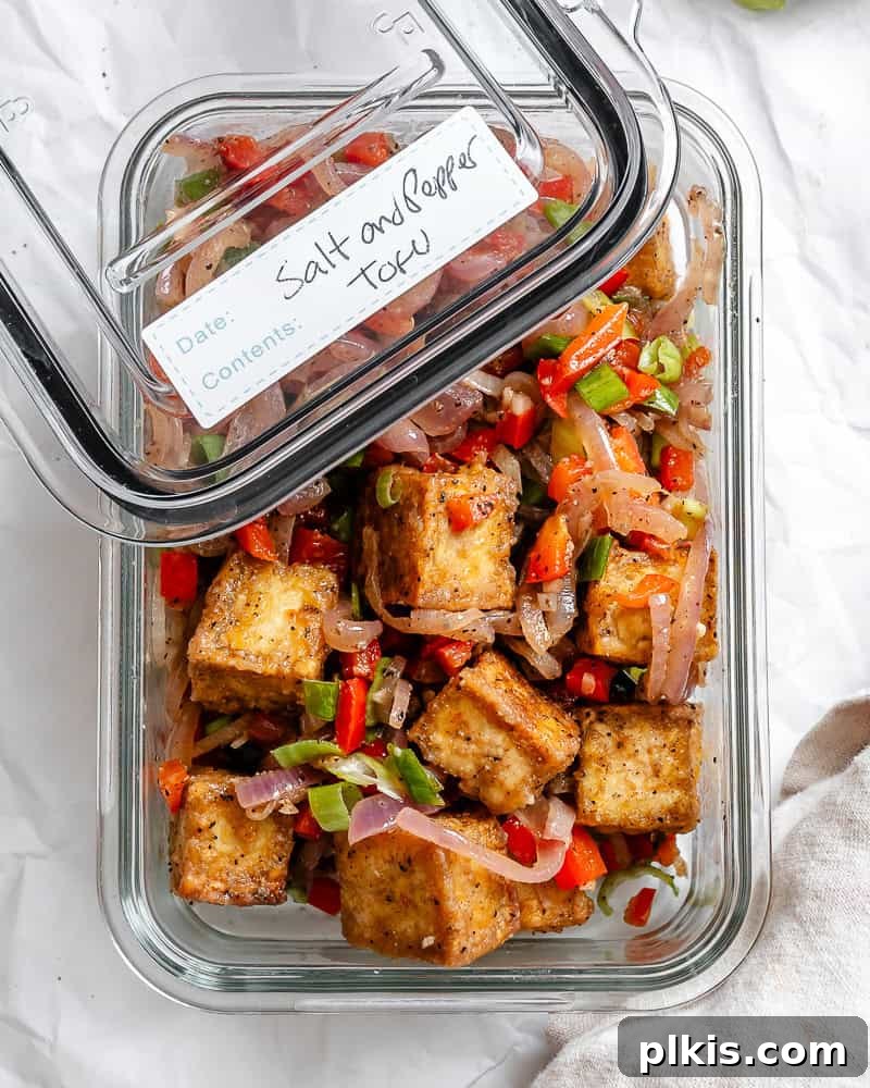 Golden Crisped Tofu Bites 10 completed Salt and Pepper Tofu in a storage container, ready for meal prep