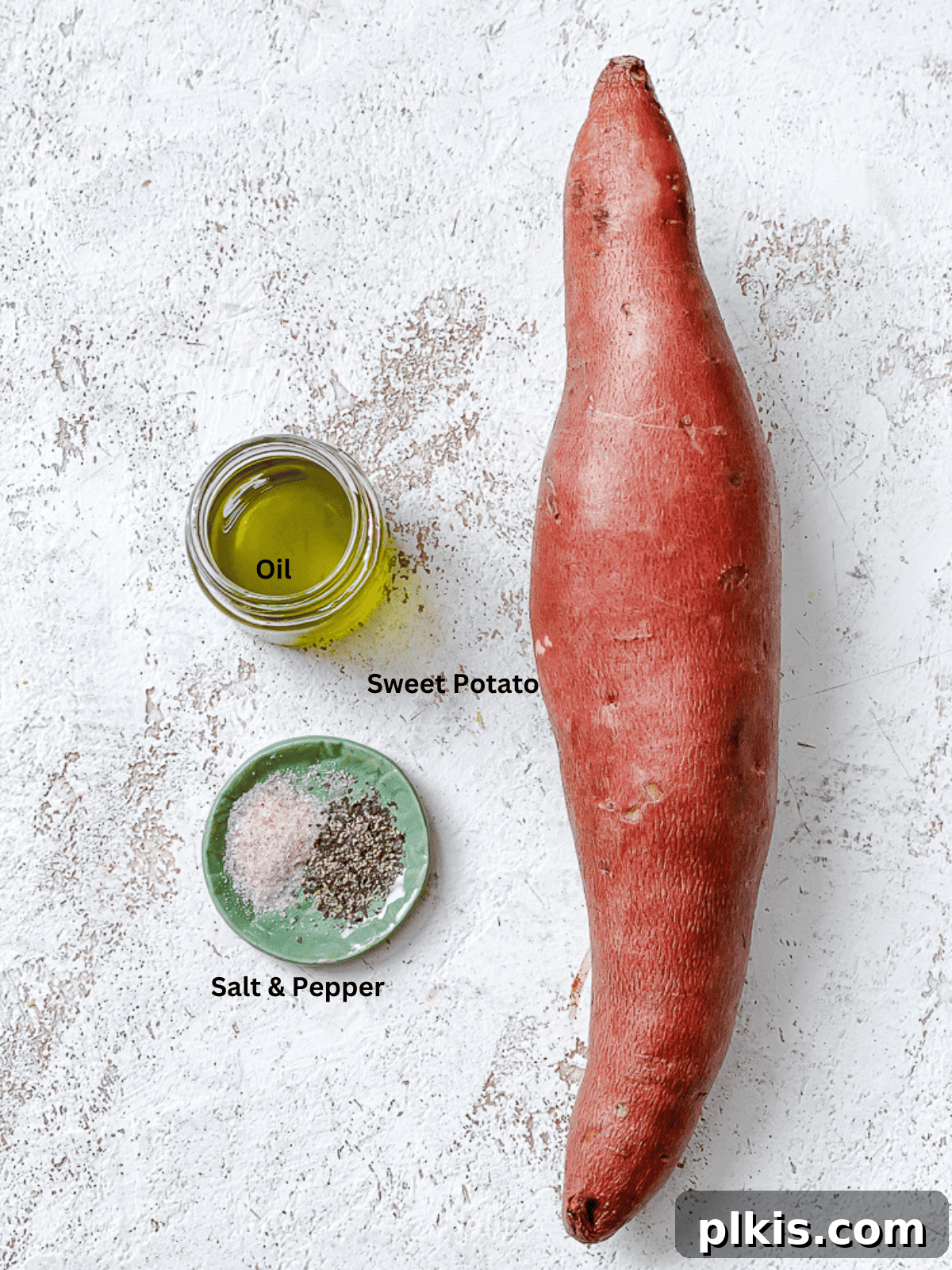 Simple Sweet Potato Rice 3 Ingredients for Easy Riced Sweet Potato measured out on a white surface, including sweet potato, oil, salt, pepper, and parsley.
