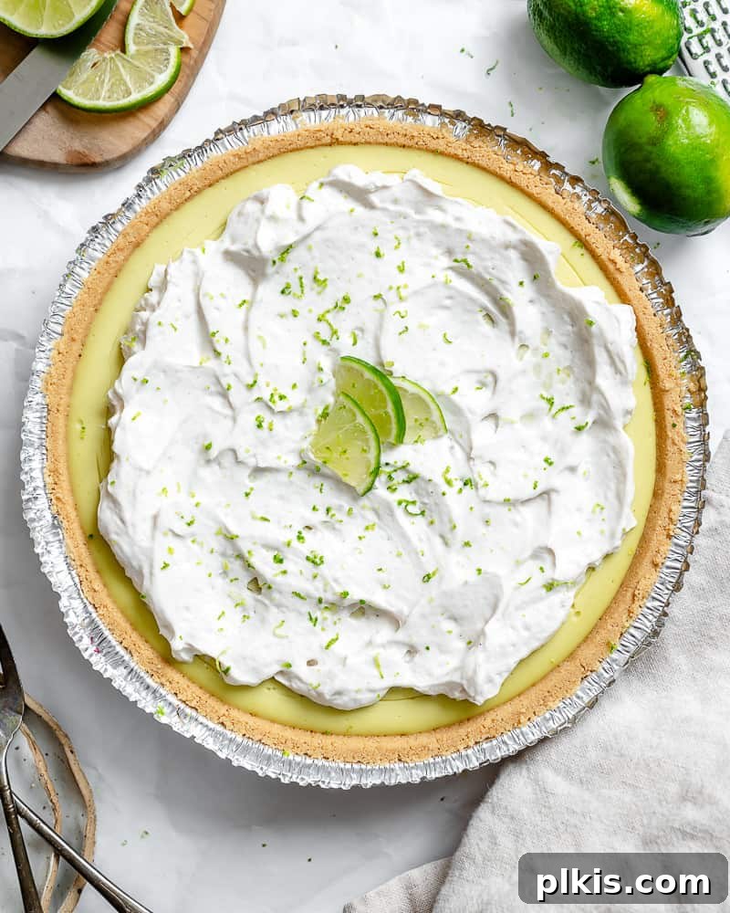 Effortless Zesty Vegan Key Lime Pie 2 Completed Easy Vegan Key Lime Pie, showing a slice with creamy filling and a golden crust.