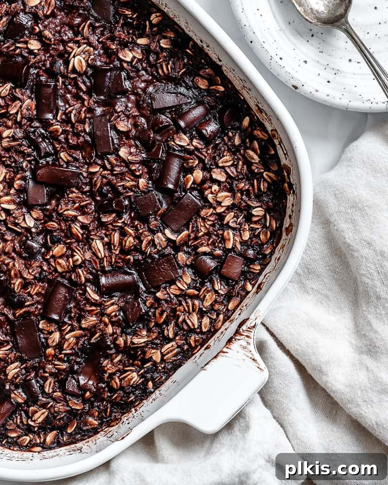 Decadent Chocolate Baked Oats: Smooth or Hearty 13 A close-up shot of a single serving of Chocolate Baked Oatmeal, showing its dense, moist texture and delicious chocolate swirls, ready to be enjoyed