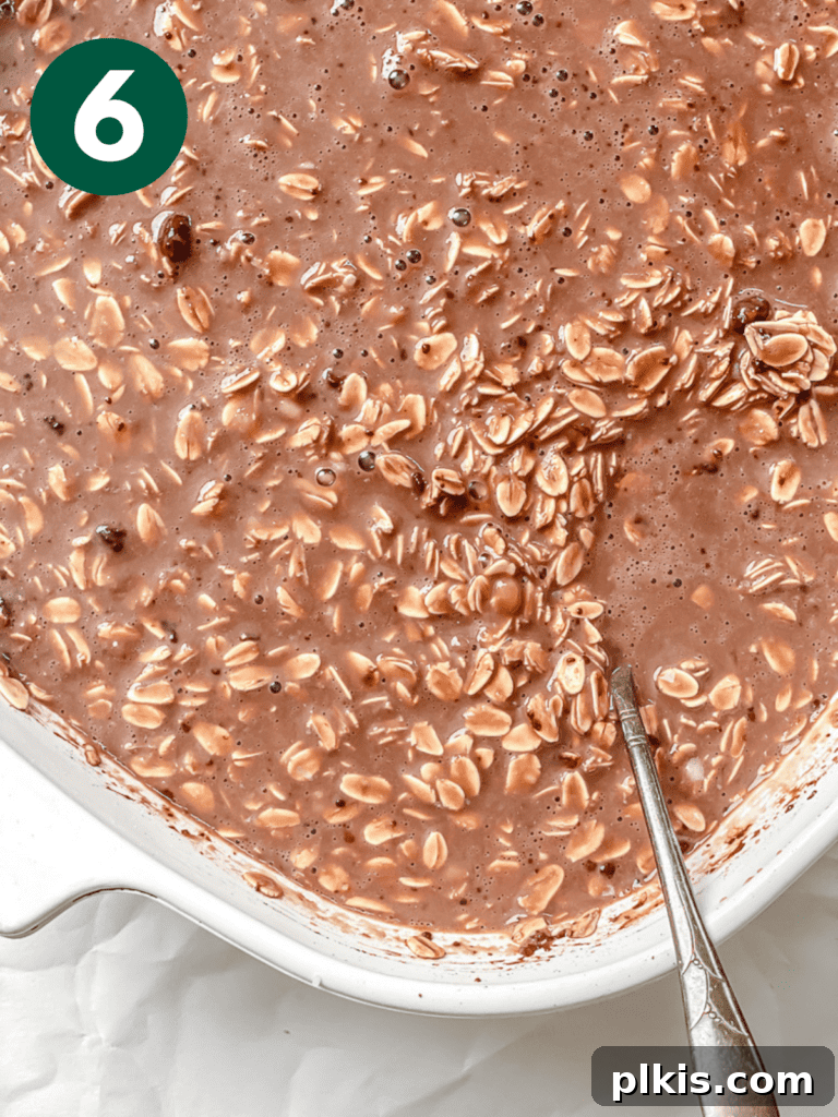 Decadent Chocolate Baked Oats: Smooth or Hearty 9 Process shot showing the mixed oat batter ready in the tray before adding toppings