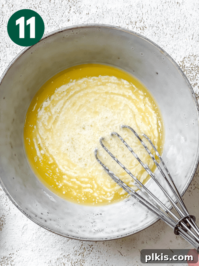 Plant-Powered Irish Soda Bread 14 Process shot showing whisking vegan butter into the soy milk-vinegar mixture.