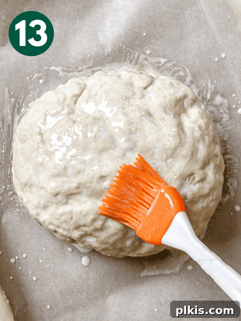 Plant-Powered Irish Soda Bread 16 Process shot showing basting the dough with the vegan butter mixture.