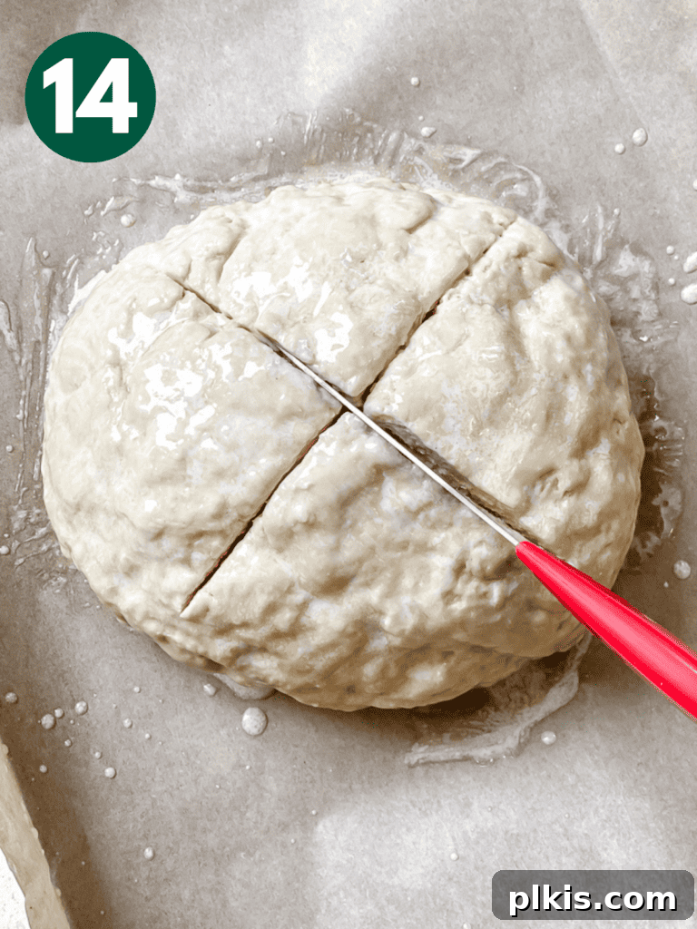 Plant-Powered Irish Soda Bread 17 Process shot of making an X-shaped slit in the top of the bread dough.