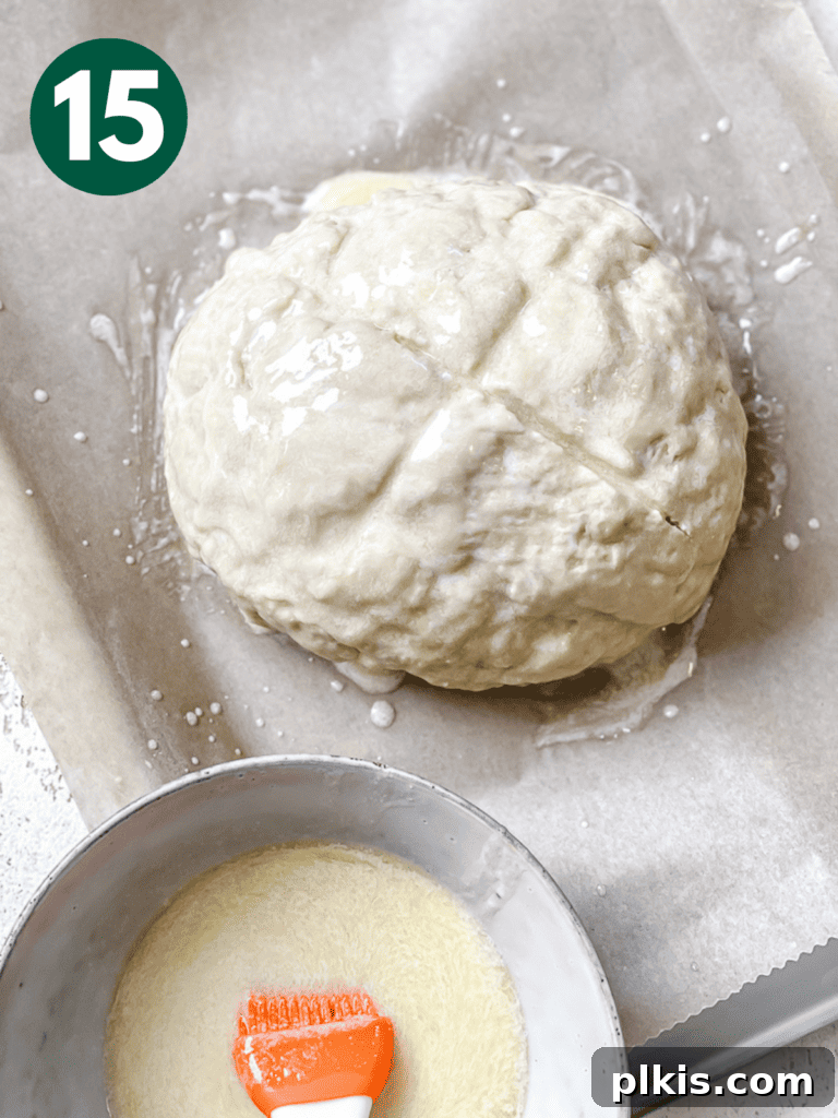 Plant-Powered Irish Soda Bread 18 Process shot showing the bread partially baked alongside the remaining basting mixture.