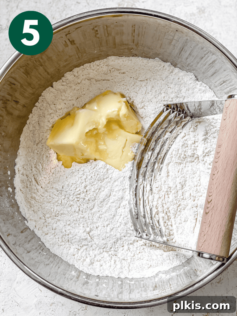 Plant-Powered Irish Soda Bread 8 Process shot showing vegan butter cut into dry ingredients, resembling wet sand.