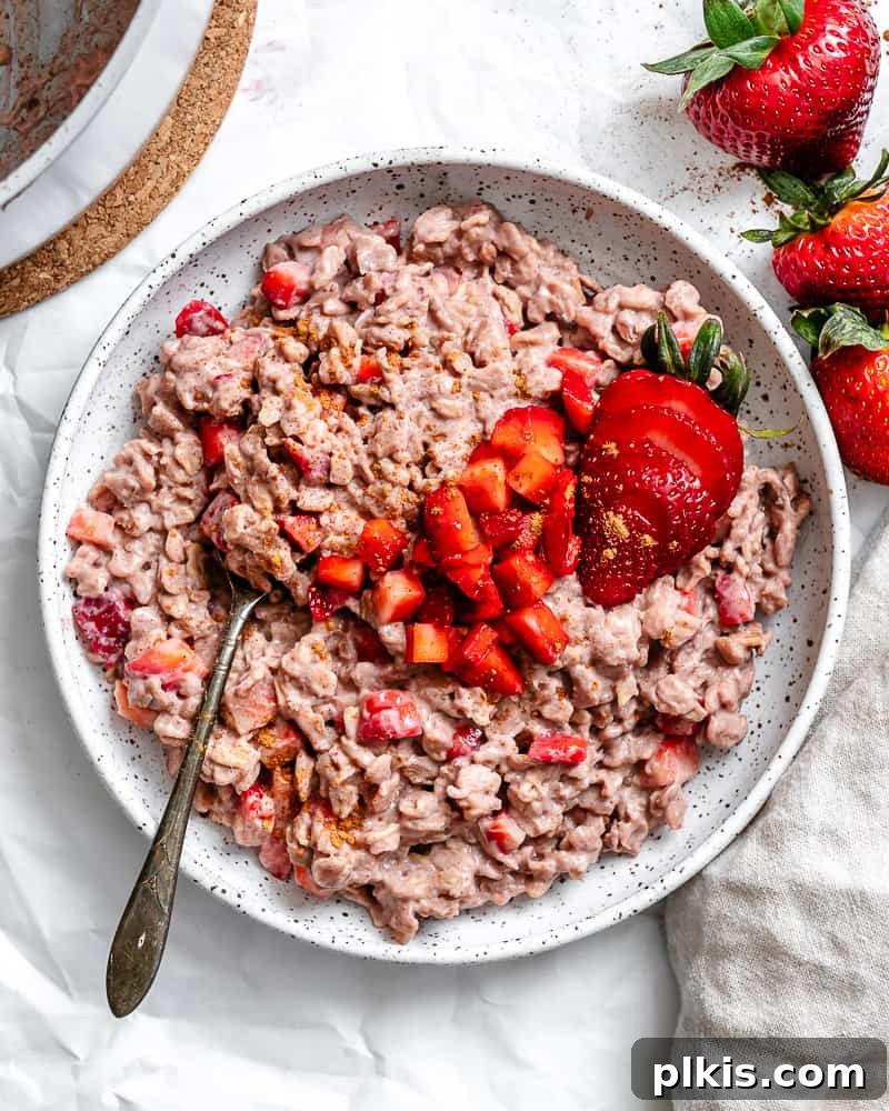 Completed Strawberry Oatmeal in a bowl, garnished with fresh berries.
