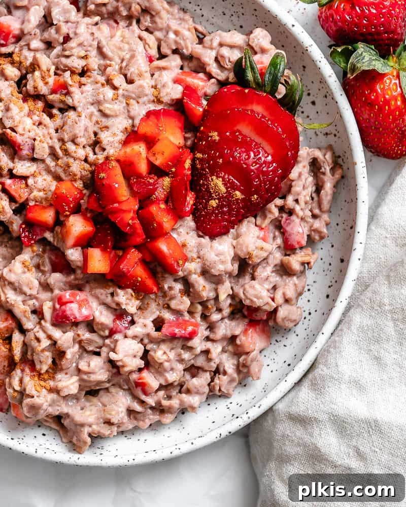 Completed Strawberry Oatmeal in a bowl, garnished with fresh berries.