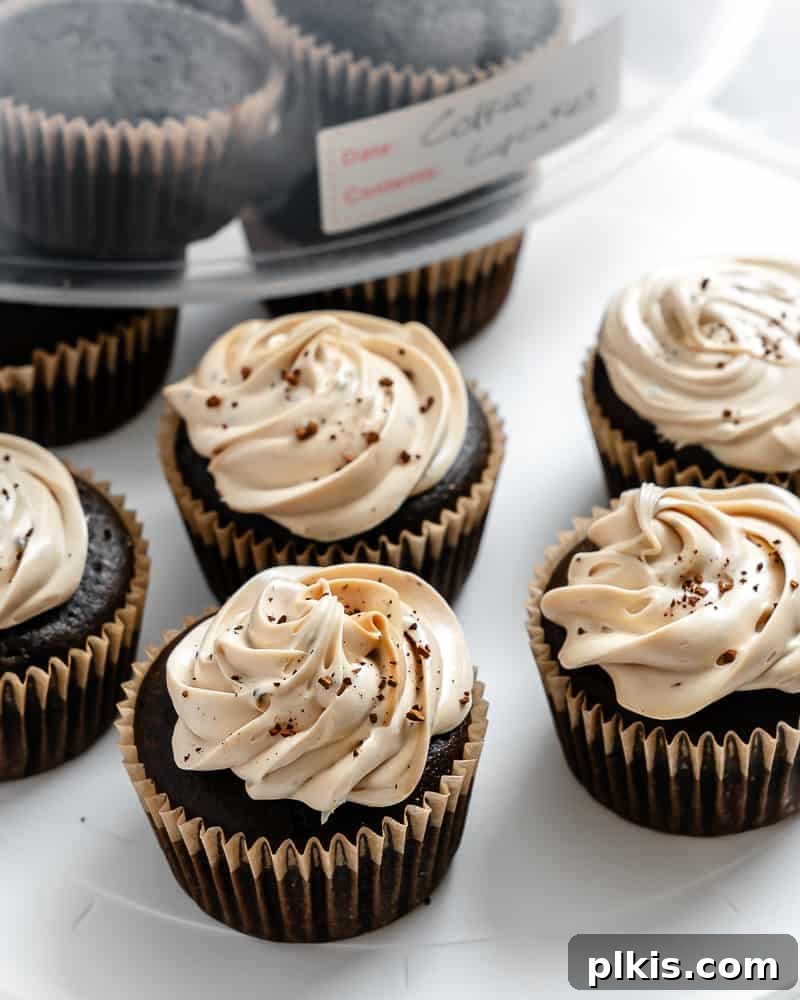Effortless Coffee Cupcakes 12 Several frosted vegan coffee cupcakes artfully arranged on a white backdrop, ready for enjoyment.