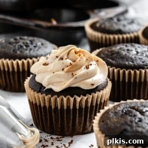 Completed easy vegan coffee cupcakes on a white surface, showcasing their delicious appearance.