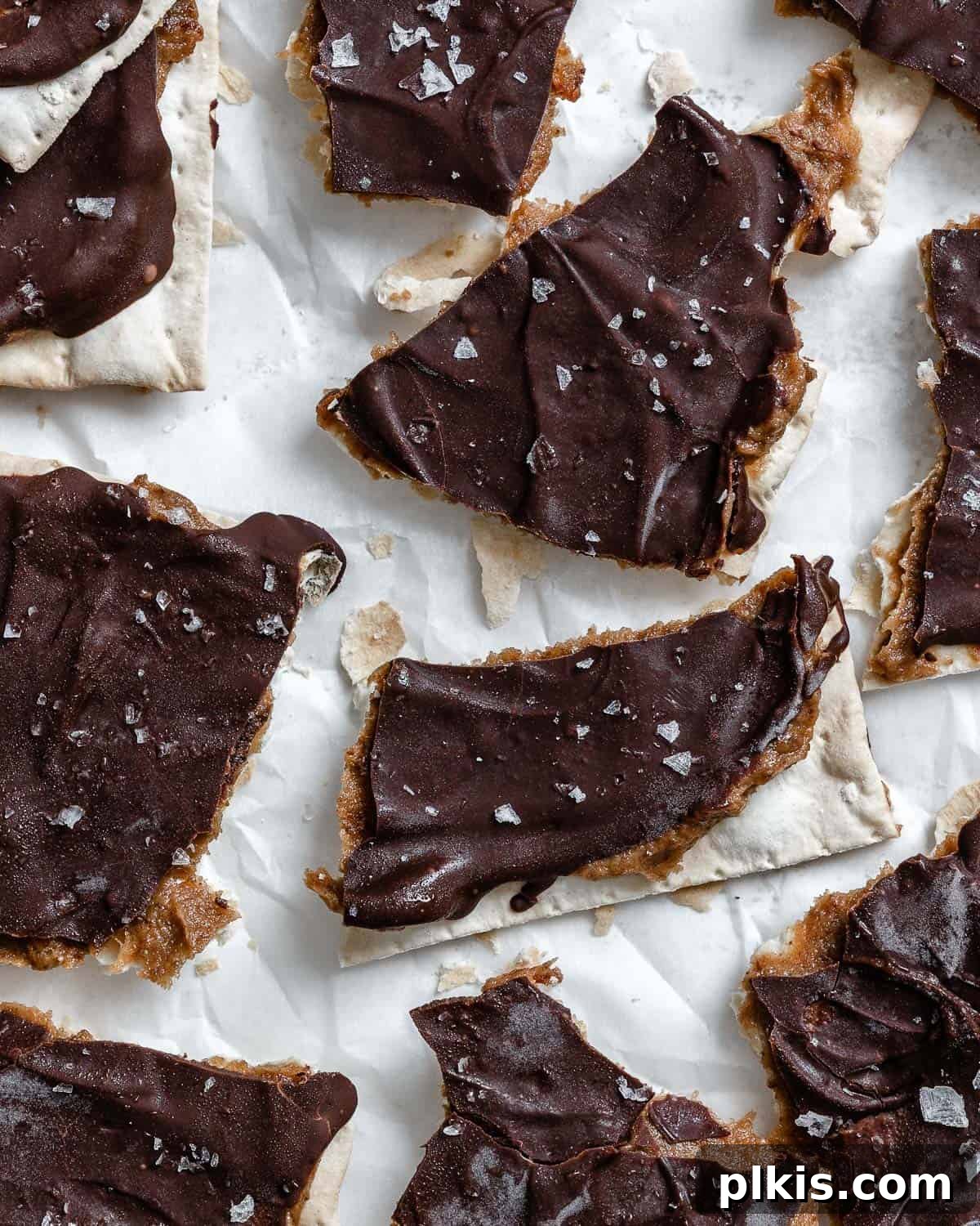 Crispy Matzo Toffee 9 Completed Matzo Bark arranged beautifully on a white surface, ready to be enjoyed.